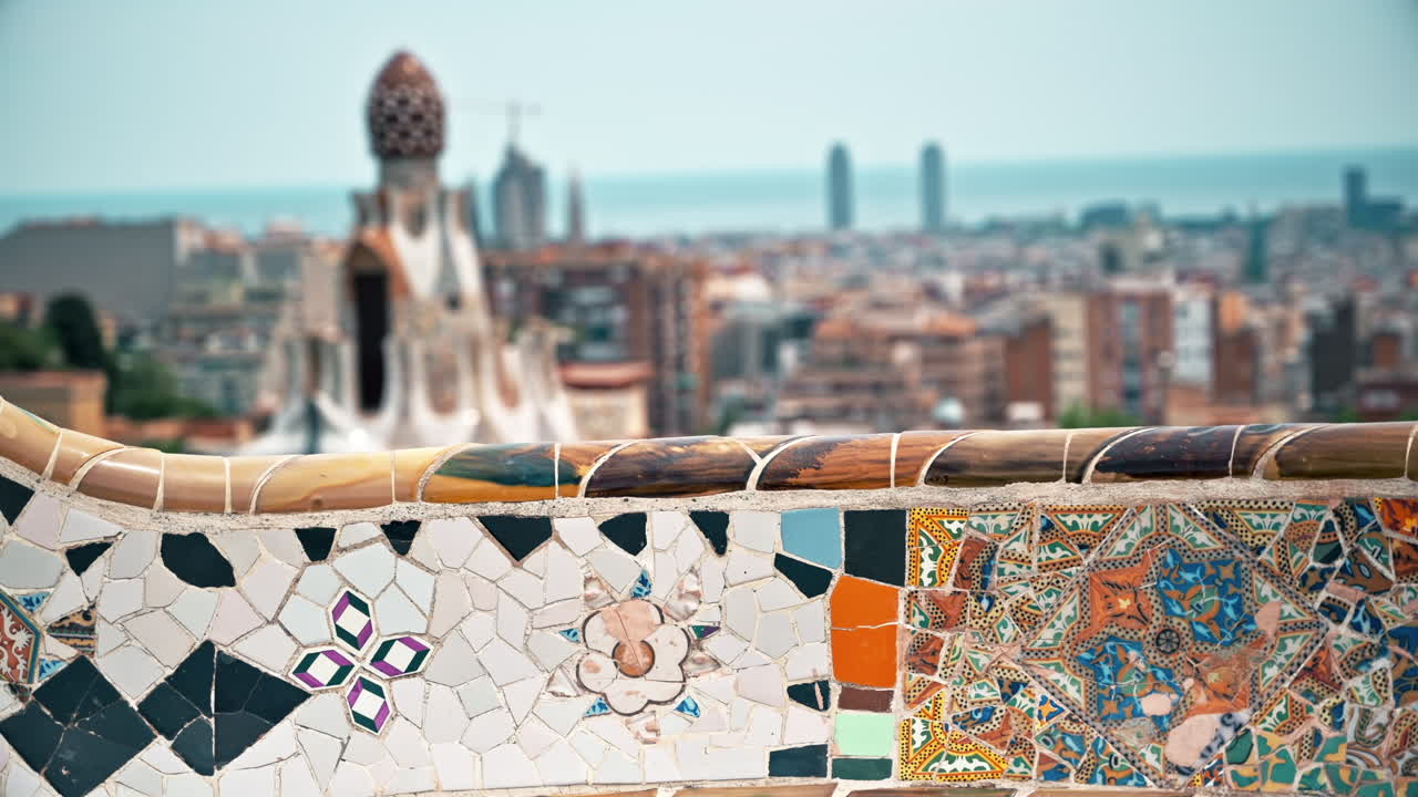 Fence in the Parc Guell with view of Barcelona on the background in Spain