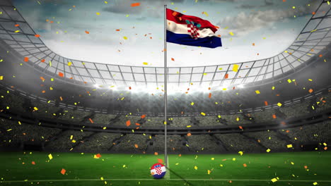 confeti cayendo sobre la bandera de croacia contra el estadio deportivo en el fondo