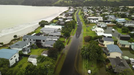 Car-drives-through-flooded-street-as-Coromandel-enters-Red-alert-Cyclone-Gabrielle