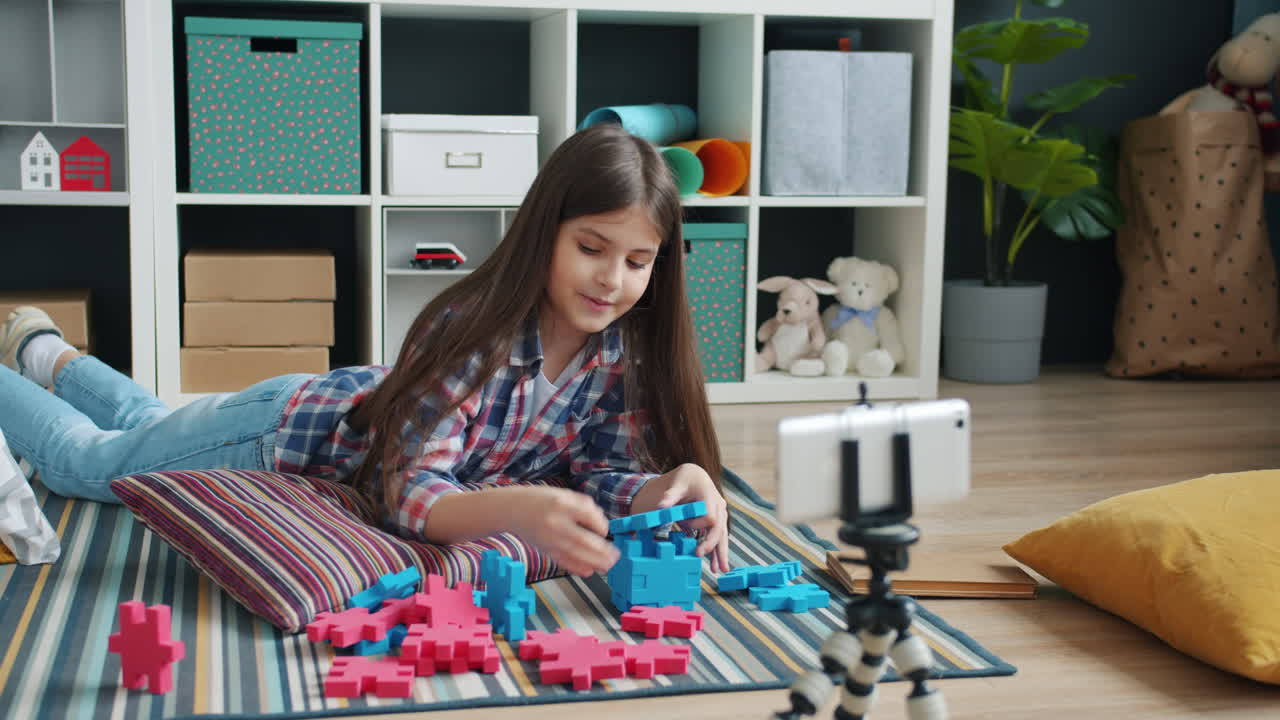 Cute Kid Playing With Building Blocks and Vlogging