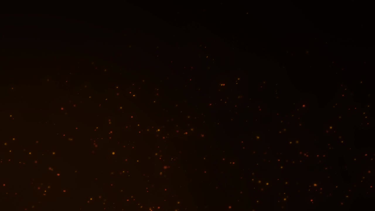 Burning red hot sparks flying from large fire flame on black background.