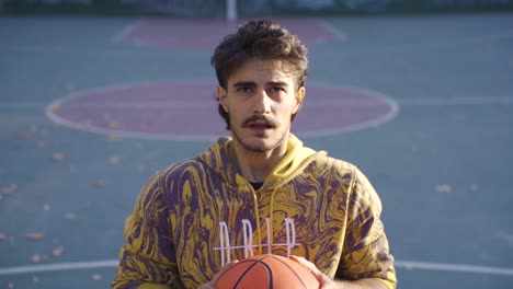 jugador de baloncesto discapacitado joven centrado en anotar en cámara lenta.