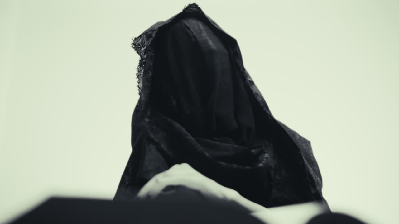 Mysterious Figure in Black Cloak