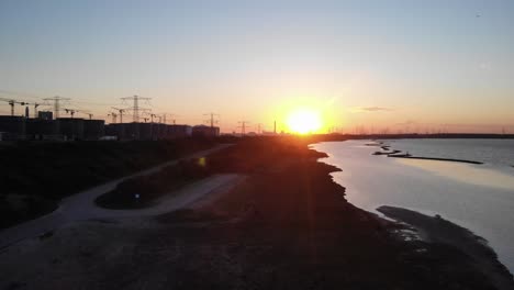 riverbank of brielse meer in netherlands at sunset
