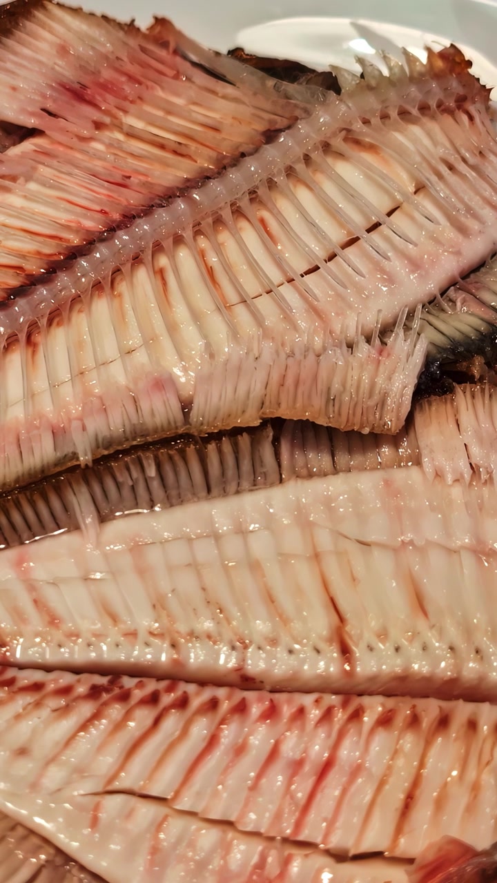 Detailed view of fish fillets showcasing the intricate bone structure, ideal for culinary or educational content.