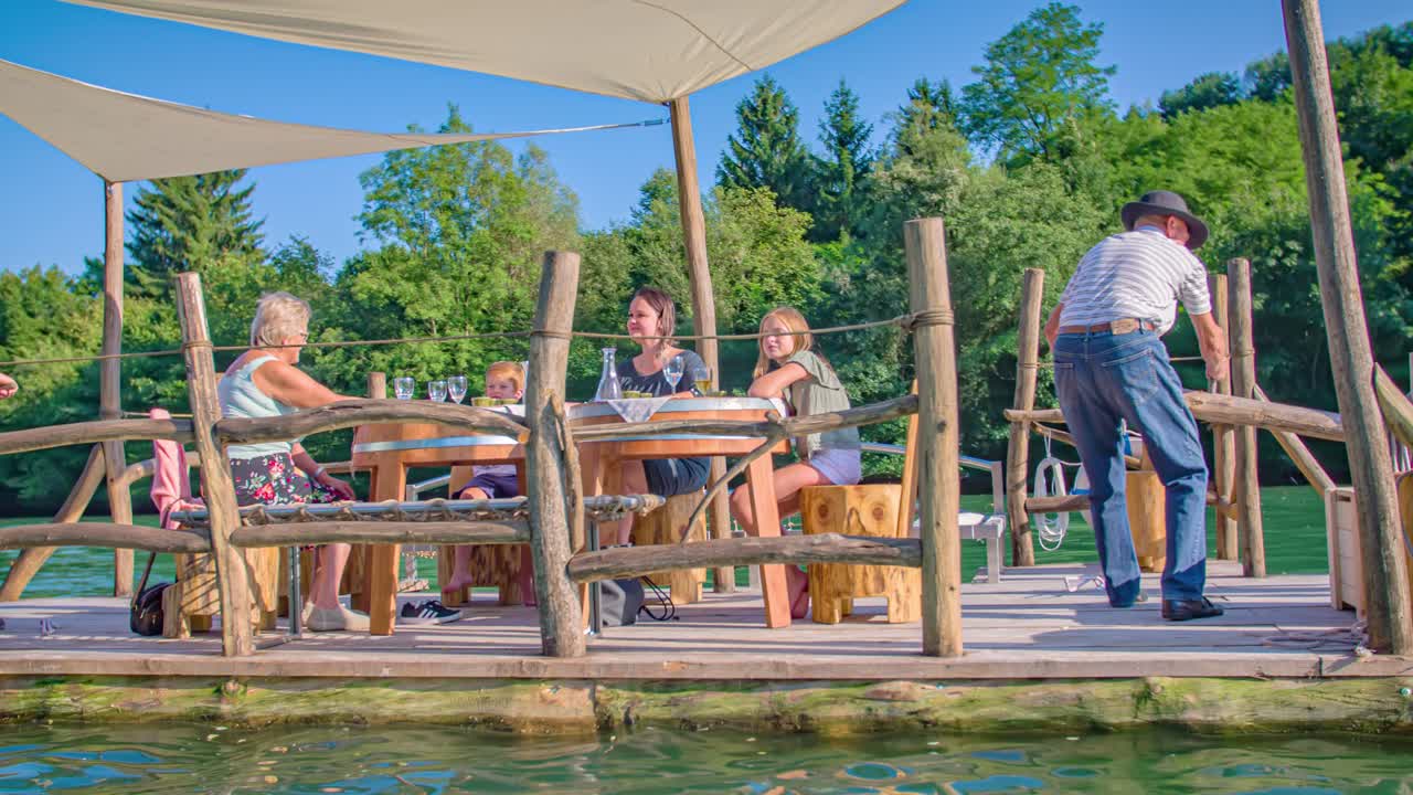 Alternative transportation on wooden log raft down Drava river, Muta, Slovenia