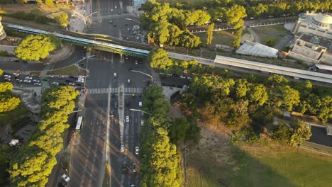 Aerial-top-down-of-traffic-on-high-frequented-Libertador-Avenue-in-Buenos-Aires-City-at-sunset