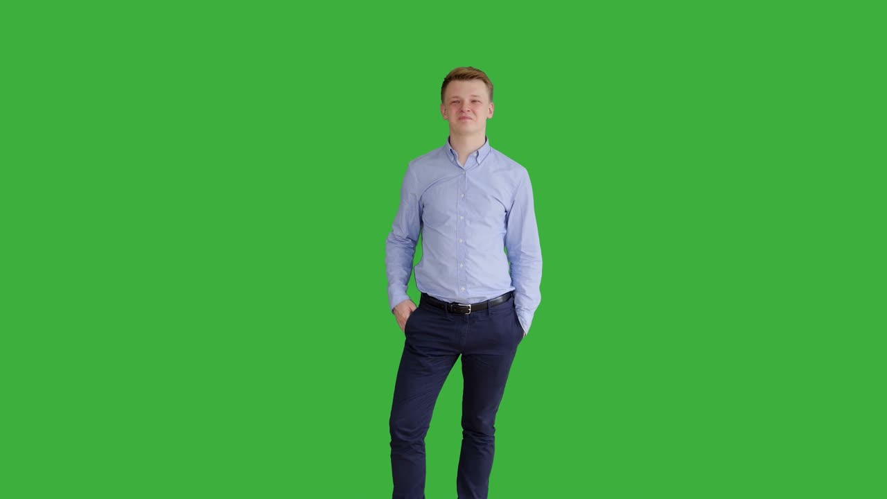 Young Handsome Men Acting in Front of a Green Screen. Blond Hair, Blue Shirt and Blue Trousers. Dancing, Thinking, Turning Around and Talking to the Camera.