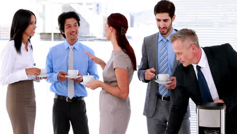 business team having coffee and chatting