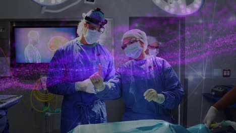 Animation-of-pink-data-network-over-diverse-surgeons-in-disuccing-in-operating-theatre