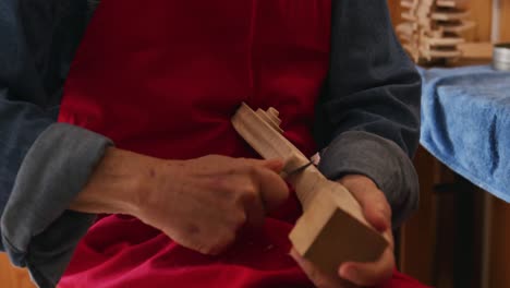 female luthier at work in her workshop