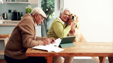 elderly couple embracing their golden retriever while planning finances at home