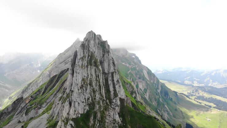 Aerial flyover around Altenalpturm peak at the Schafler ridge in Appenzell, Switzerland