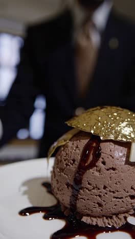 gourmet chocolate ice cream dessert with gold leaf