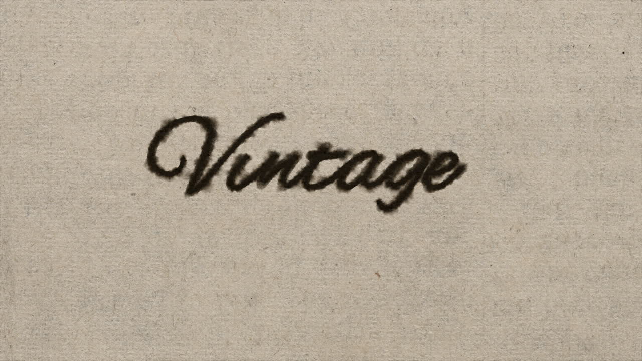 Script font graphic with ink bleeding into paper and on green screen, writing the text &amp;quot;vintage&amp;quot;, in 4k at 60fps