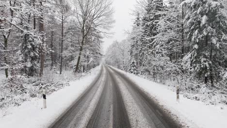 aerial view of a snowy road in northern germany