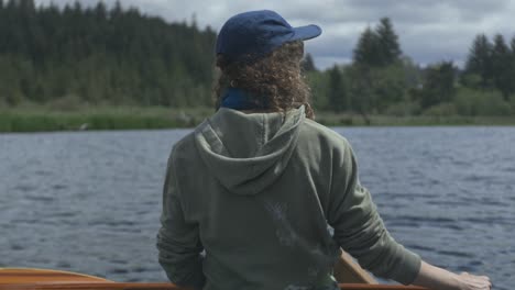 Back-of-a-person-on-a-canoe-in-Beaver-Creek,-Brian-Booth-State-Park,-Oregon-coast