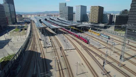 establishing aerial drone shot of vienna train station railway transportation, day