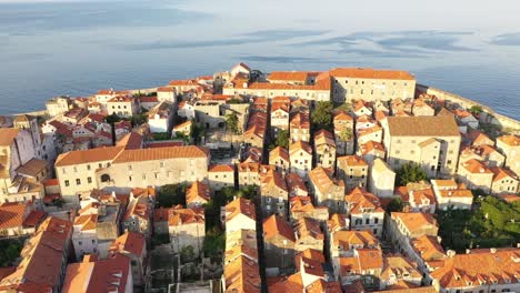 panoramic aerial view of dubrovnik old town during sunset on coast of adriatic sea, dalmatia, croatia - popular travel destination unesco world heritage sites of croatia