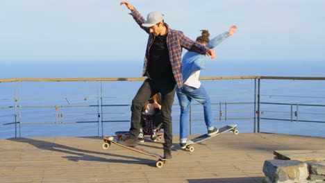 side view of young caucasian male skateboarder riding on skateboard at observation point 4k