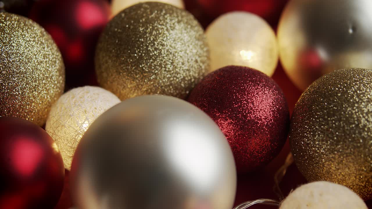 beautiful red and gold baubles on a Christmas background