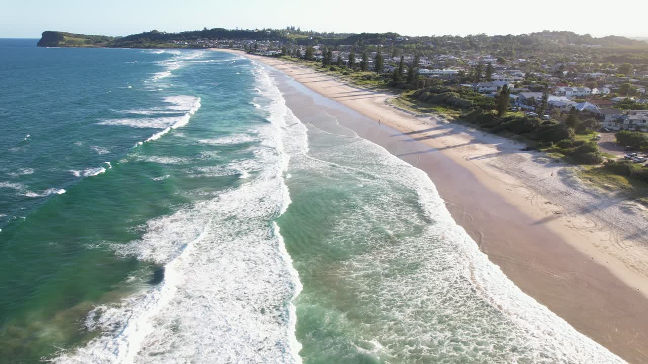 Aerial View Of Foamy Waves In The Shoreline Of Seven Mile Beach In Lennox Head, New South Wales, Australia.