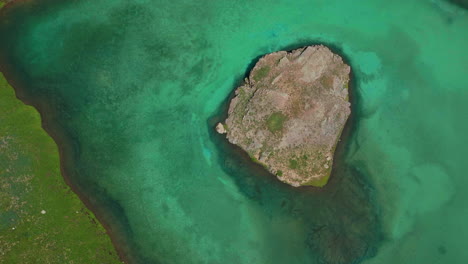 Epic-looking-down-cinematic-aerial-drone-high-elevation-dreamy-heavenly-Island-Lake-Silverton-Ice-Lake-Basin-unreal-Caribbean-aqua-blue-Silverton-Colorado-lush-green-summer-Rocky-Mountains-up-motion