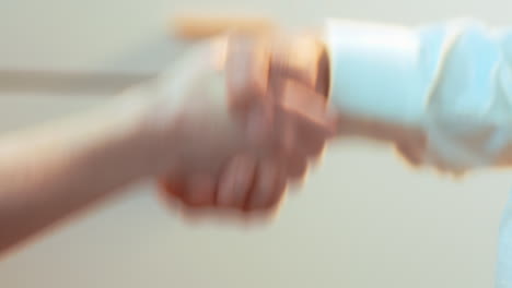 a woman pays cash for car key fob, then long handshake