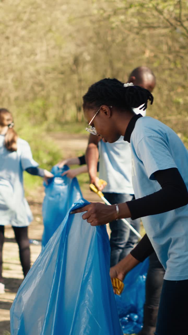 Dedicated Volunteers Collecting Garbage in a Natural Environment