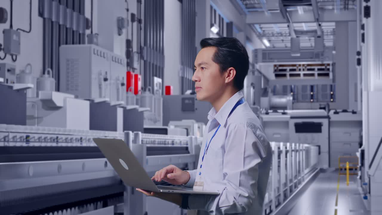Side View Of An Asian Male Professional Worker Standing At Pharmaceutical Factory, Vaccine Production Facility, Observes By Looking Up Before He Come To Concentrating On The Laptop And Keep On Typing