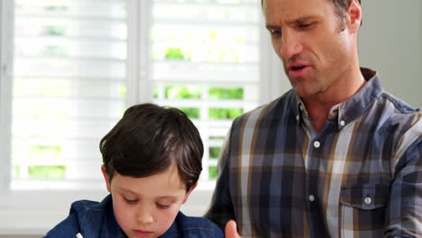 Father-helping-son-with-school-homework