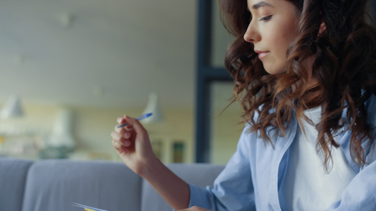 Focused woman creating music song