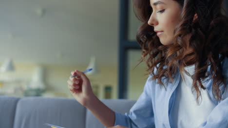 Focused woman creating music song