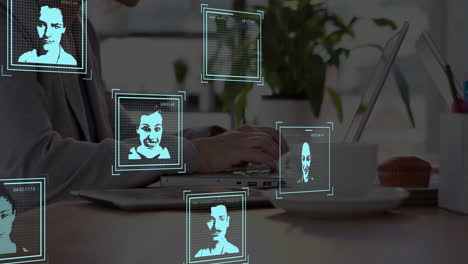 facial recognition animation over person typing on laptop in office