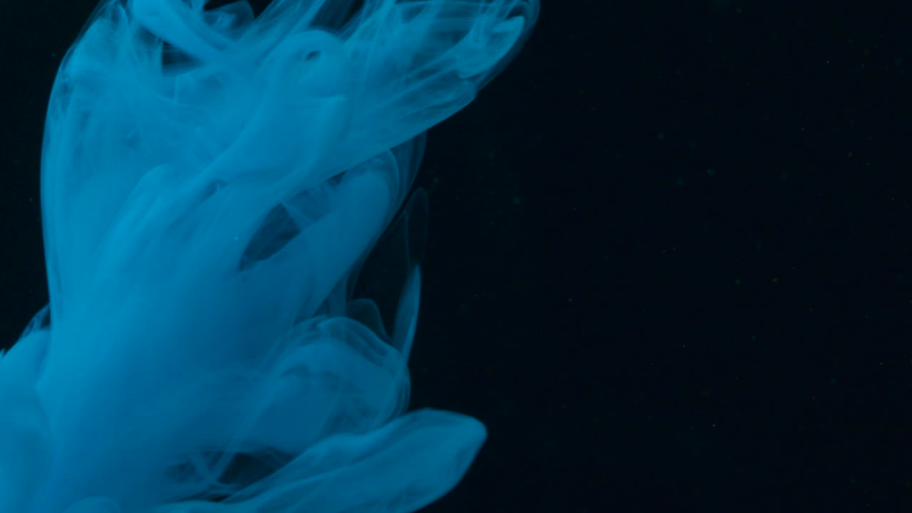 Blue Ink Flowing in Water