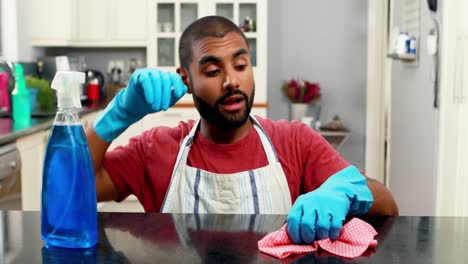 man cleaning the kitchen worktop 4k