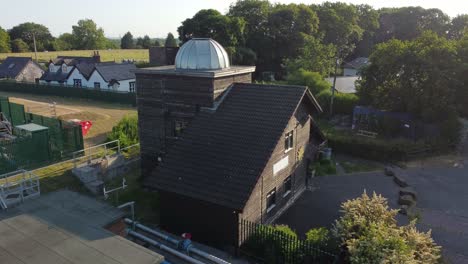 aerial view pex hill leighton observatory rising to silver dome rooftop on hilltop farmland at sunrise