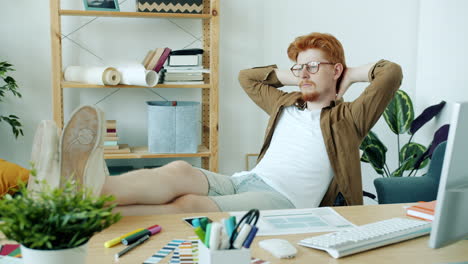 man relaxing at his home office