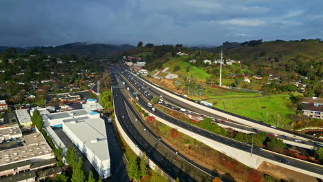 Modern-road-highway-transportation-junction-network-moving-traffic-aerial