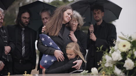 funeral, family hug and sad people with grief