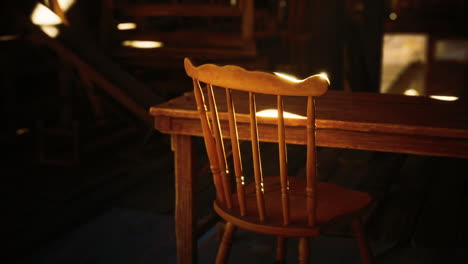 a rustic wooden chair and table with sunlight shining through