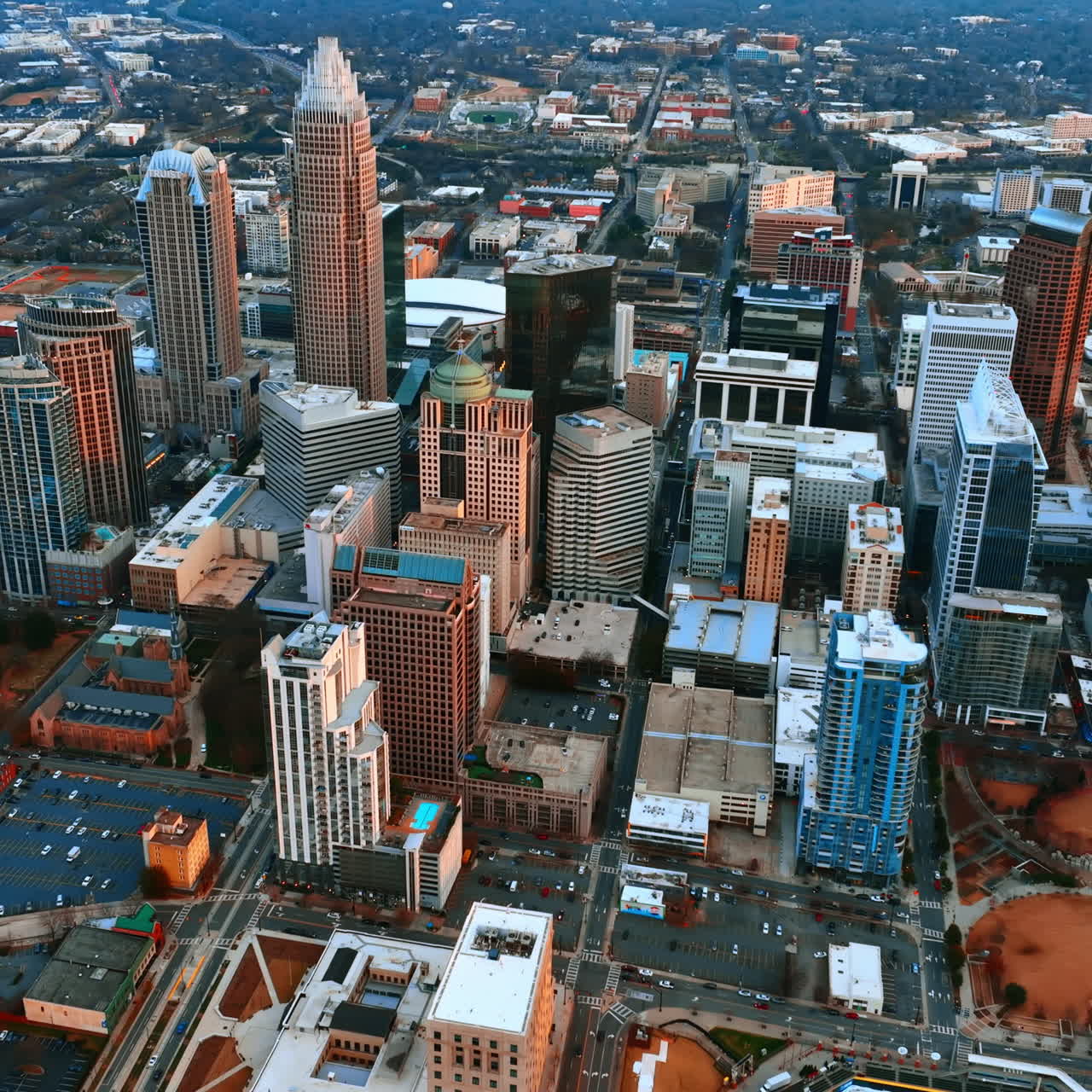 Approaching the densely built uptown of Charlotte, North Carolina. Drone footage above the modern American city.