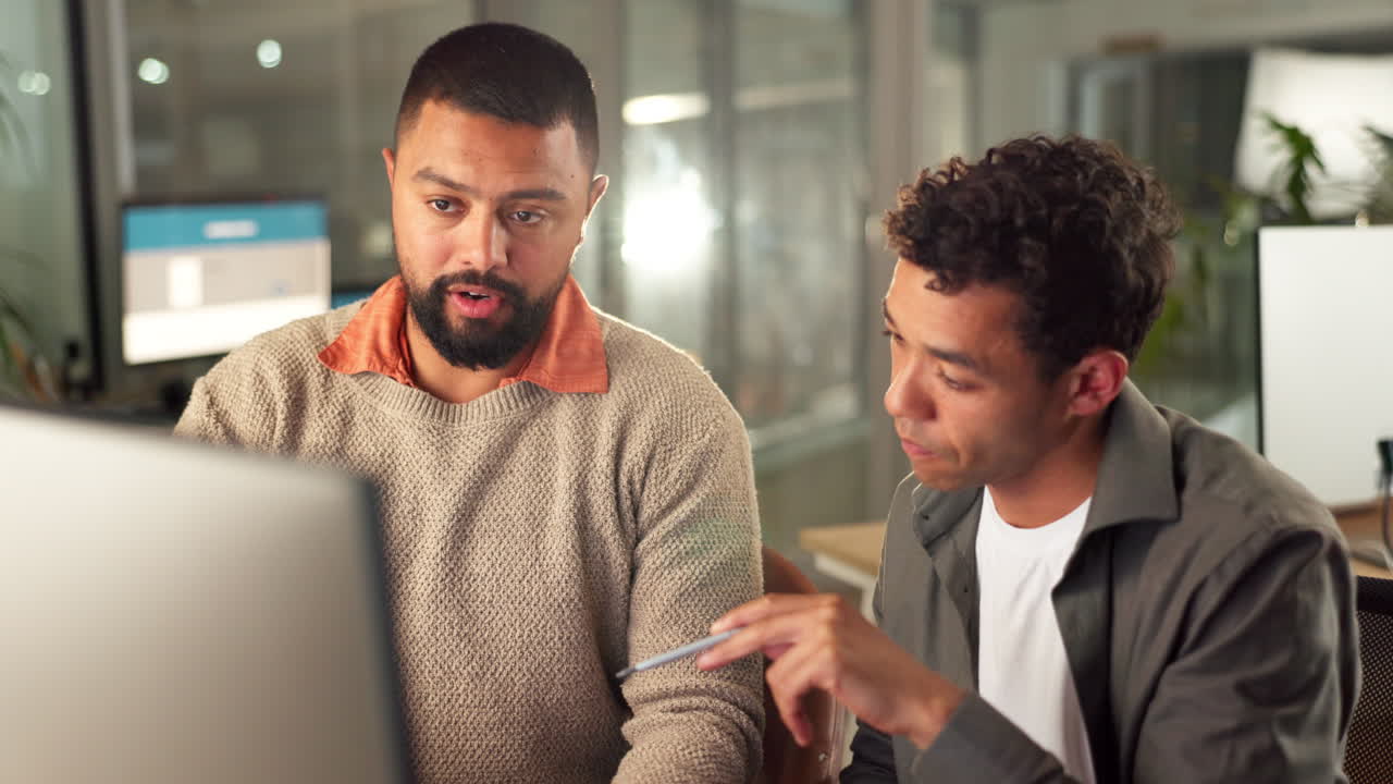 Business colleagues discussing project at night