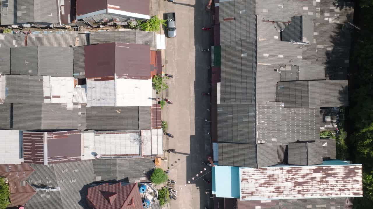 Aerial view of Lanta Old Town, rustic rooftops, sunny day, Thailand calm