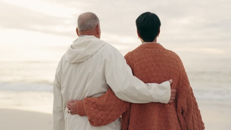 back, hug and couple at the beach for a walk