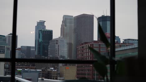 minneapolis city skyline through the windows of a condo building in downtown