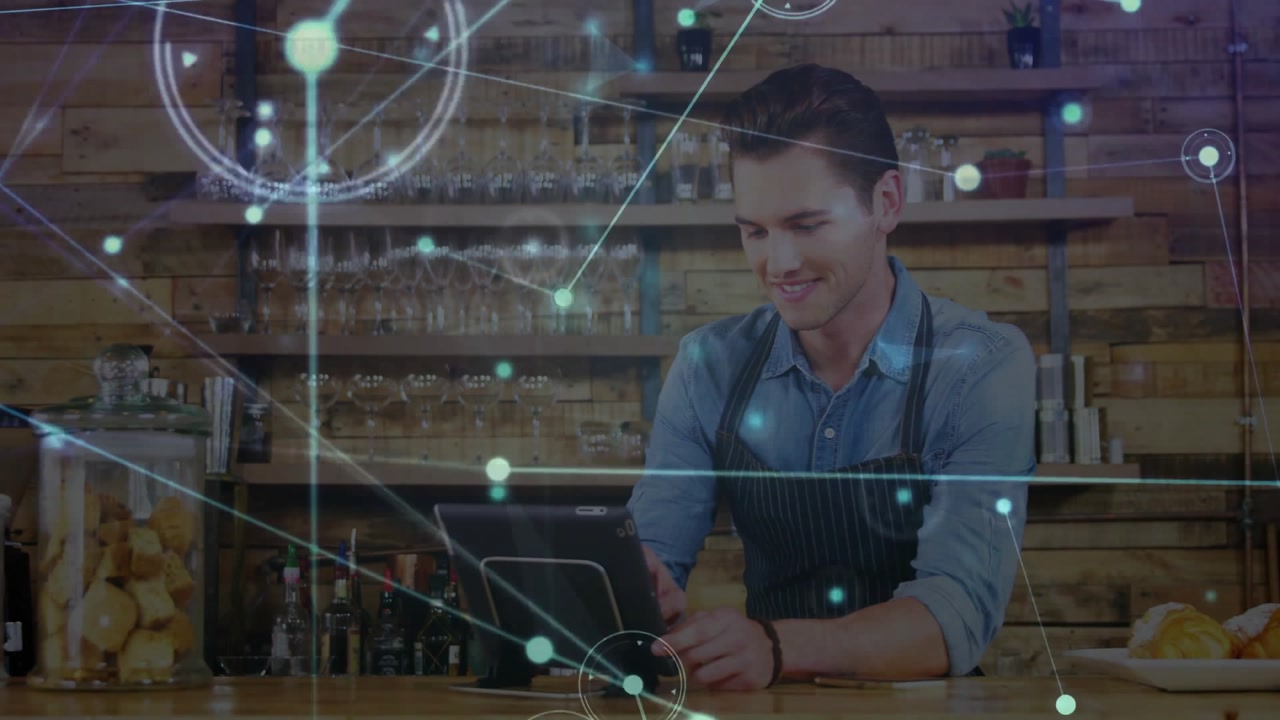 Barista tapping tablet behind coffee counter, overlay fading, intensifying nodes syncing order info
