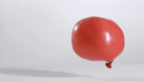 red balloon moving in super slow motion