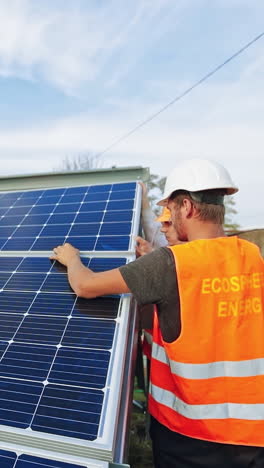 innovative solution for energy solving. professional workers installing solar panels on the metal construction