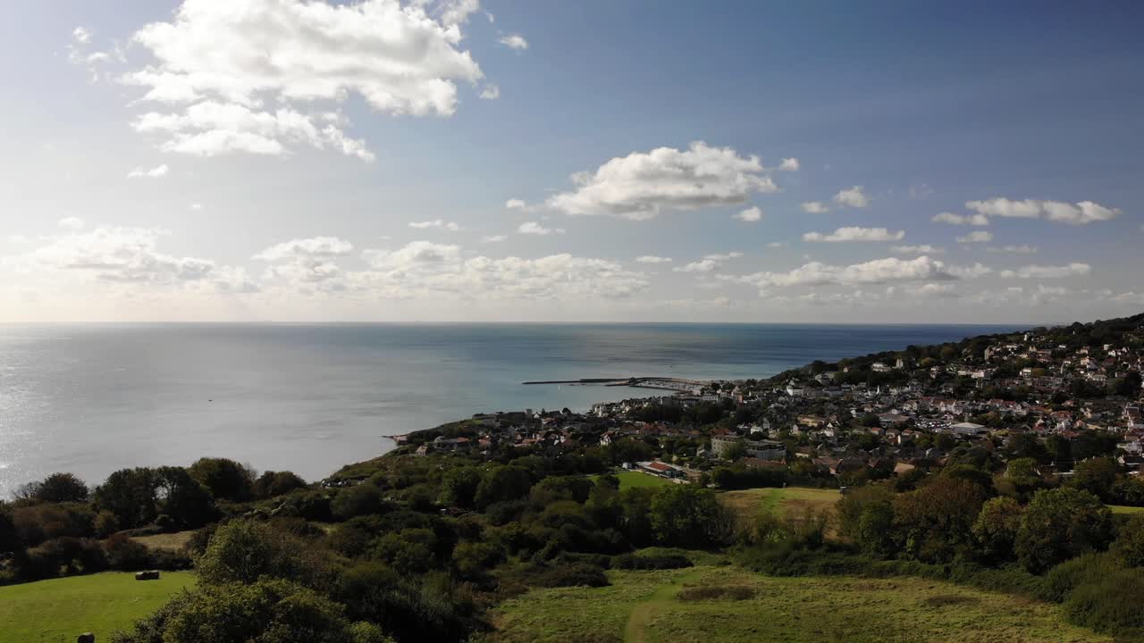 Lyme Regis Overlooking English Channel On Sunny Day. Aerial Pedestal Up